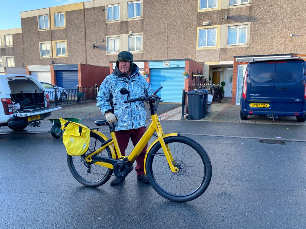 Steve Watson arriving on his yellow bike