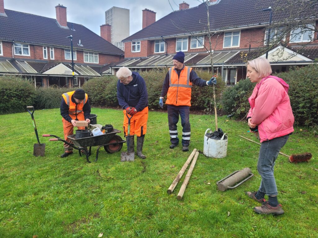 Malcolm, Steve, and Mark of the Woodland team, and BTP's Katy Hawkins, getting ready to dig the planting hole for the new windsor place tree in nechells.