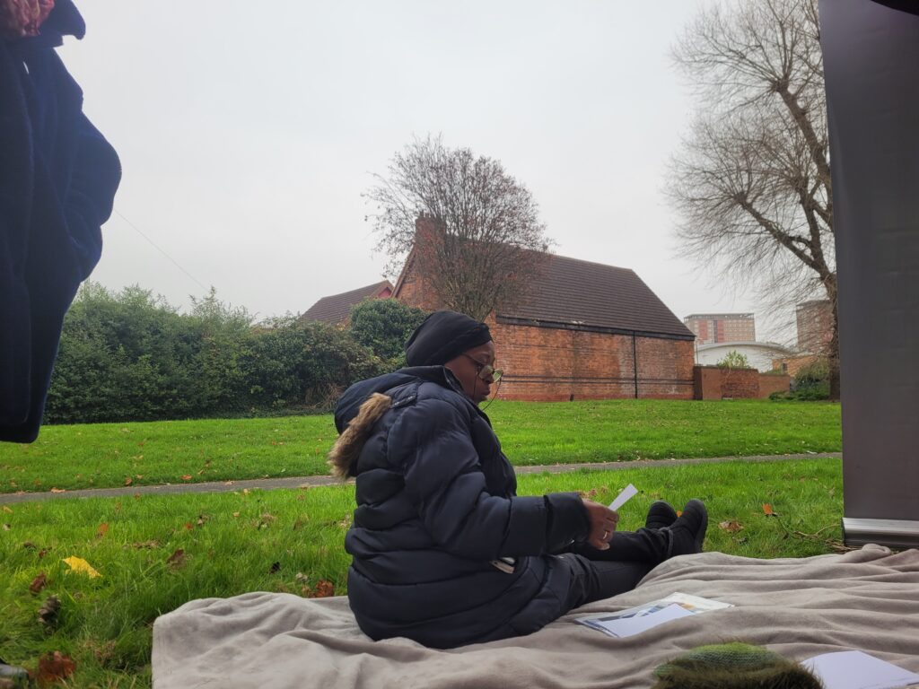 Sonya reading her poetree in Burbury Park, Chair of the Burbury Park Community Forum.