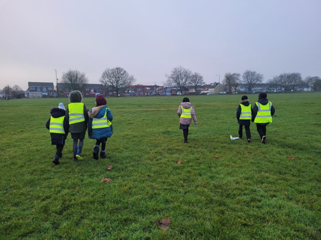 Daisy Farm Park Friends tree planting with Highters Heath Community School - the children running across the field