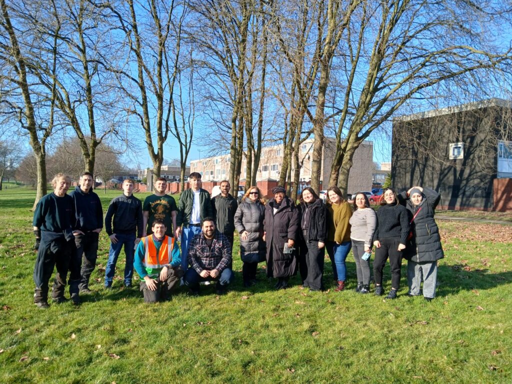 Refugee & Migrant Centre planting in The Zephaniah Forest, 13/02/25, team pictured with Matt (Ops Man) and Milly (Benjamin's sister) in Burbury Park.